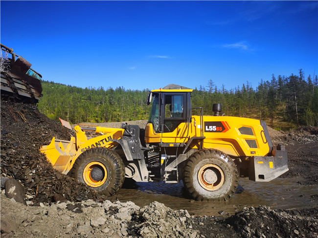 Shantui L55-B5 wheel loader works on a mining site in east europe country